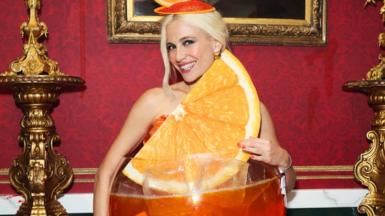 Pixie Lott wearing an Aperol Halloween costume