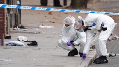 Forensic investigators at the scene in Friar Gate, Derby, where a number of people had been injured, some of them seriously, but not life-threatening, after being hit by a car in the city centre on Saturday night. 