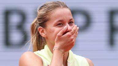 Polish qualifier Maja Chwalinska covers her mouth with her hand after completing victory over Anna Kalinskaya 