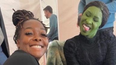 Shea and Cynthia pose for the camera while Shei does her nails while she is in Wicked costume 