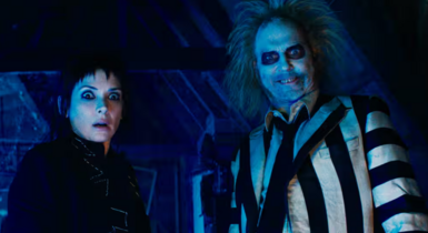 Winona Ryder and Michael Keaton looking surprised in Beetlejuice Beetlejuice