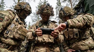  British Army 3 Rifles soldiers use a phone-sized electronic screen display, which forms part of the Android Team Awareness Kit (ATAK), at an undisclosed training ground less than 50 kilometres from the Russian border in Finland where Nato troops are taking part in Exercise Northern Star, led by the Finnish military.