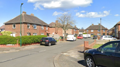 A Google street view of Hardale Grove. It is a residential cul-de-sac with cars parked on the pavement. 