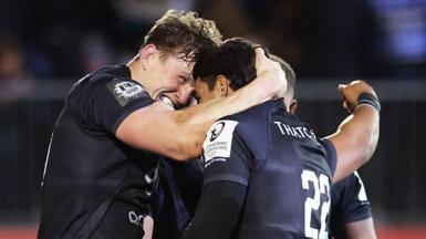 Ted Hill celebrates his match-winning try with his Bath team-mates