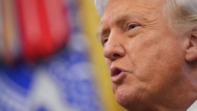 President Donald Trump speaks to reporters in the Oval Office