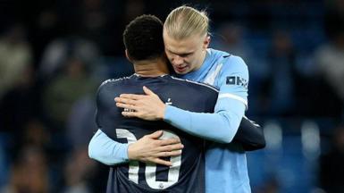 Erling Haaland hugs Mbappe