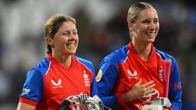 Heather Knight and Freya Kemp smile after England beat India