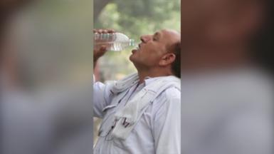 Man drinking from bottle of water