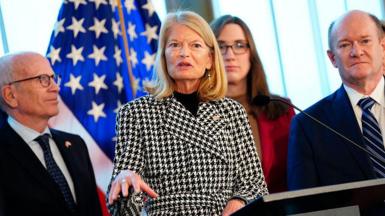 Senator Lisa Murkowski, flanked by other members of the US Congress, speaks at a press conference in Copenhagen