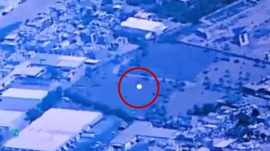 Image shows a UFO with a red circle around it.