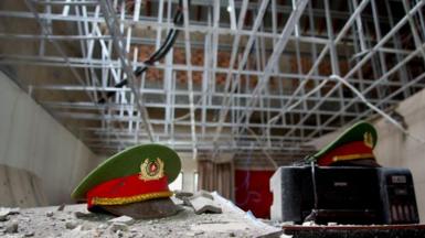 Vietnamese police caps coated with dust in one of the many rooms in Royal Hill Casino