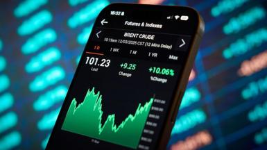 Oil prices are seen displayed on a mobile device