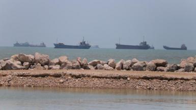 Ships in the distance on the coast line near Iran.