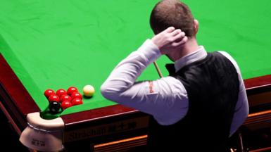Mark Allen scratches his head
