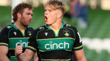 Henry Pollock celebrates