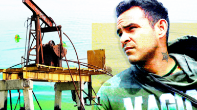 A designed image of a old rusty oil pump on the left and a young man with dark hair on the right. He is looking wistfully into the distance. He is wearing a grey hoodie with magic written on it in white and green letters.