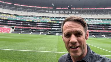 Will Grant takes a photo looking into his phone camera inside Mexico City’s Azteca Stadium.