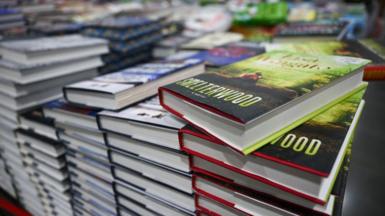 Stacks of books are displayed for sale inside a store in Inglewood, California.