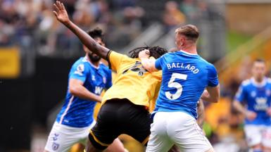 Dan Ballard pulling on Tolu Arokodare