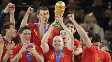 Andres Iniesta lifting the World Cup