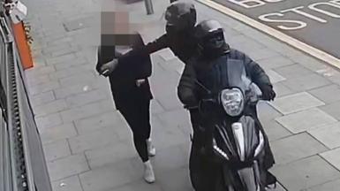 Handout photo issued by Metropolitan Police of a phone snatching incident in London.