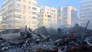 A man looks at the remains of buildings destroyed in the Israeli strike that killed Hezbollah leader Hassan Nasrallah, in Beirut's southern suburbs, Lebanon (29 September 2024)