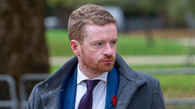 Morgan McSweeney, former Downing Street Chief of Staff, seen in Westminster, London, 5 November 2025. He was wearing a grey coat over a blue suit, white shirt and purple tie.