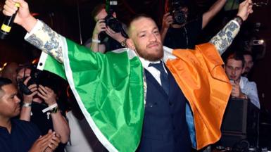 Conor McGregor draped in the Irish tricolour