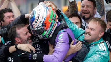 Kimi Antonelli celebrates with members of his Mercedes team after winning the Miami Grand Prix