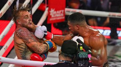 Jake Paul and British boxer Anthony Joshua trade punches during their non-title heavyweight bout at the Kaseya Center in Miami, Florida