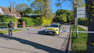 Police officers patrol at a cordon near to an incident at the Kenton United Synagogue in Harrow
