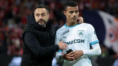 Roberto De Zerbi talks to Mason Greenwood following a Ligue 1 football match between Lille and Marseille