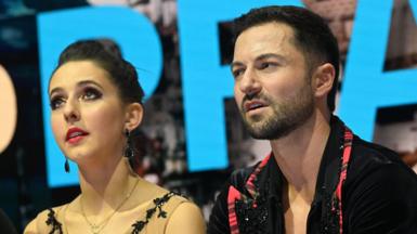 Lilah Fear and Lewis Gibson react as their results are revealed at the ice dance World Championships