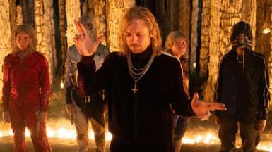 Erin Kellyman, wearing red, and Jack O'Connell, centre, in 28 Years Later: The Bone Temple 