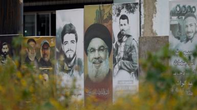 A poster showing the late Hezbollah leader Hassan Nasrallah and slain fighters from the Lebanese armed group in the southern Lebanese city of Tyre