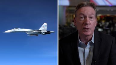 Split screen showing Russian Su-27 alongside RAF Rivet Joint aircraft on the left, and Frank Gardner in studio on the right