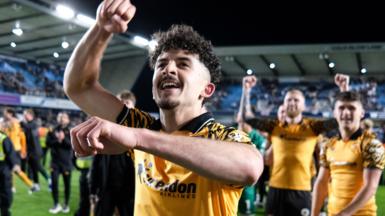 Hull City winger Mohamed Belloumi celebrates in front of his team-mates after their 2-0 win at Millwall