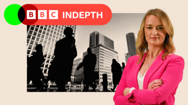 Office workers and commuters walking through Canary Wharf