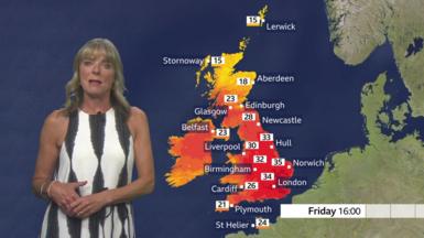 Louise Lear in front of a red UK map