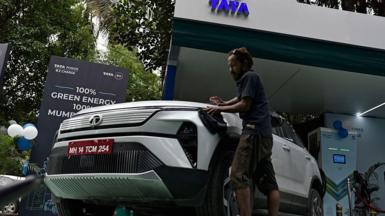 A man cleans a Tata Harrier EV during the launch of the TATA EV charging hub in Mumbai, India, on September 9, 2025.