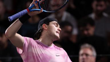 Jack Draper threatens to throw his racquet during his defeat by Alex de Minaur at the Paris Masters