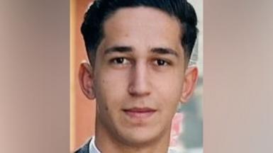 Young man - Abdullah - looking straight at the camera. He has short dark hair.