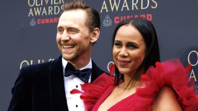 English actor Tom Hiddleston (L) and English actor Zawe Ashton pose on the green carpet for the Olivier Awards 2026 at the Royal Albert Hall in London, Britain, 12 April 2026