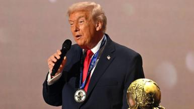U.S. President Donald Trump speaks as he receives the FIFA Peace Prize from Gianni Infantino