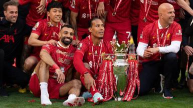 Liverpool celebrate with Premier League trophy