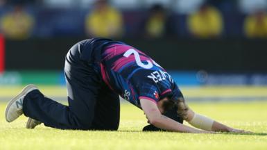 Rachel Slater puts head to the floor while fielding 