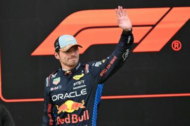 Max Verstappen waves in celebration after taking pole for the United States Grand Prix sprint race