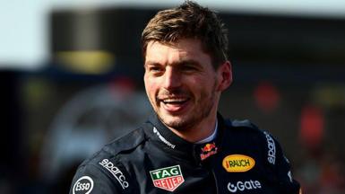 Max Verstappen in a black Red Bull racing outfit