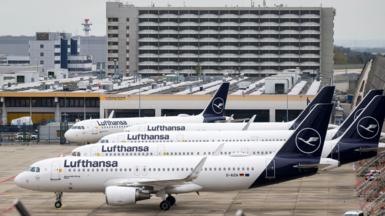 Parked Lufthansa aircraft are lined up at Frankfurt Airport on April 13, 2026.