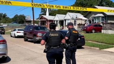 Police officers secure a street where eight children, with ages ranging from 1 to 14, were killed in a mass shooting in Shreveport, Louisiana, U.S. April 19, 2026, in a still image from video.